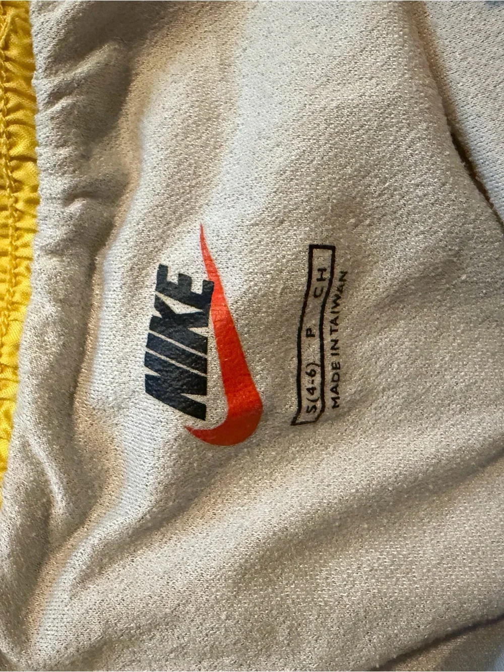 Nike Yellow Shorts with Black and Red Swoosh